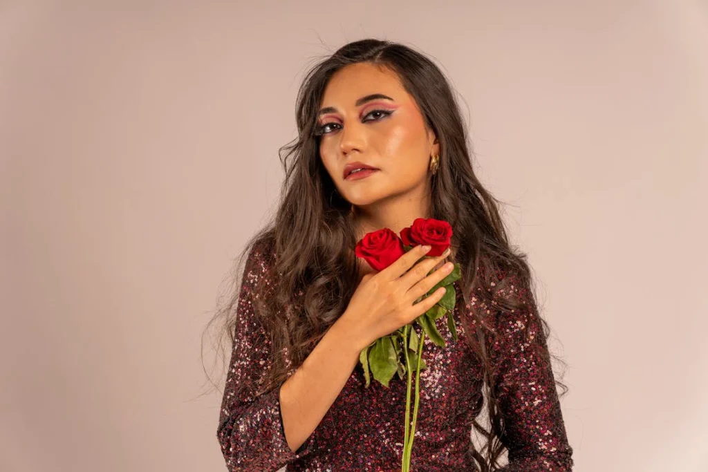 free-photo-of-elegant-woman-holding-roses-in-glitt