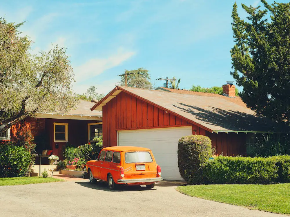 free-photo-of-vintage-orange-car-parked-in-suburba